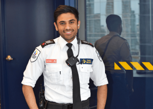 Paladin Security guard, Clyton Fernandes at office tower with reflection in window