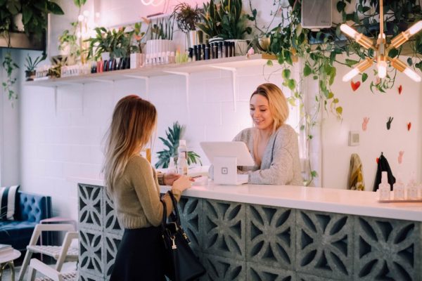 Employee behind cash register