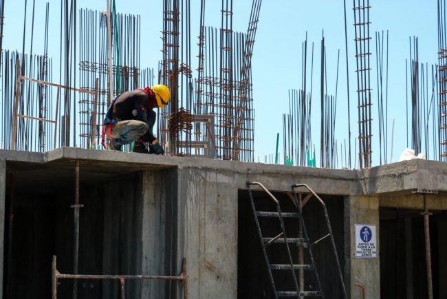 Construction worker on top of building