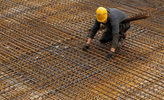 Construction worker bending over