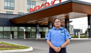 Paladin Security Guard standing in front of an emergency entrance